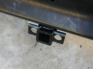 Mounted trailer hitch to the school bus bumper