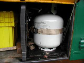 Seatbelt holds propane tank
